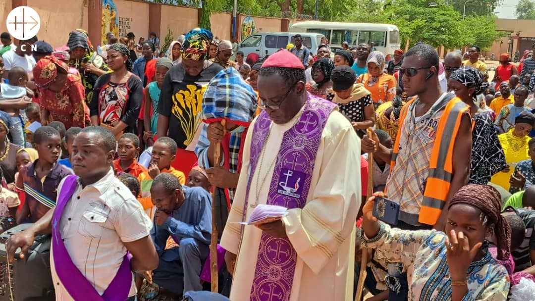 Bishop Matthew Kuka is praying with faithful in his diocese